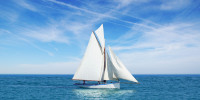 Beautiful white gaff-rigged cutter with gaff top sail and two staysails