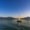 Smooth water sailboat panorama with dusk setting in