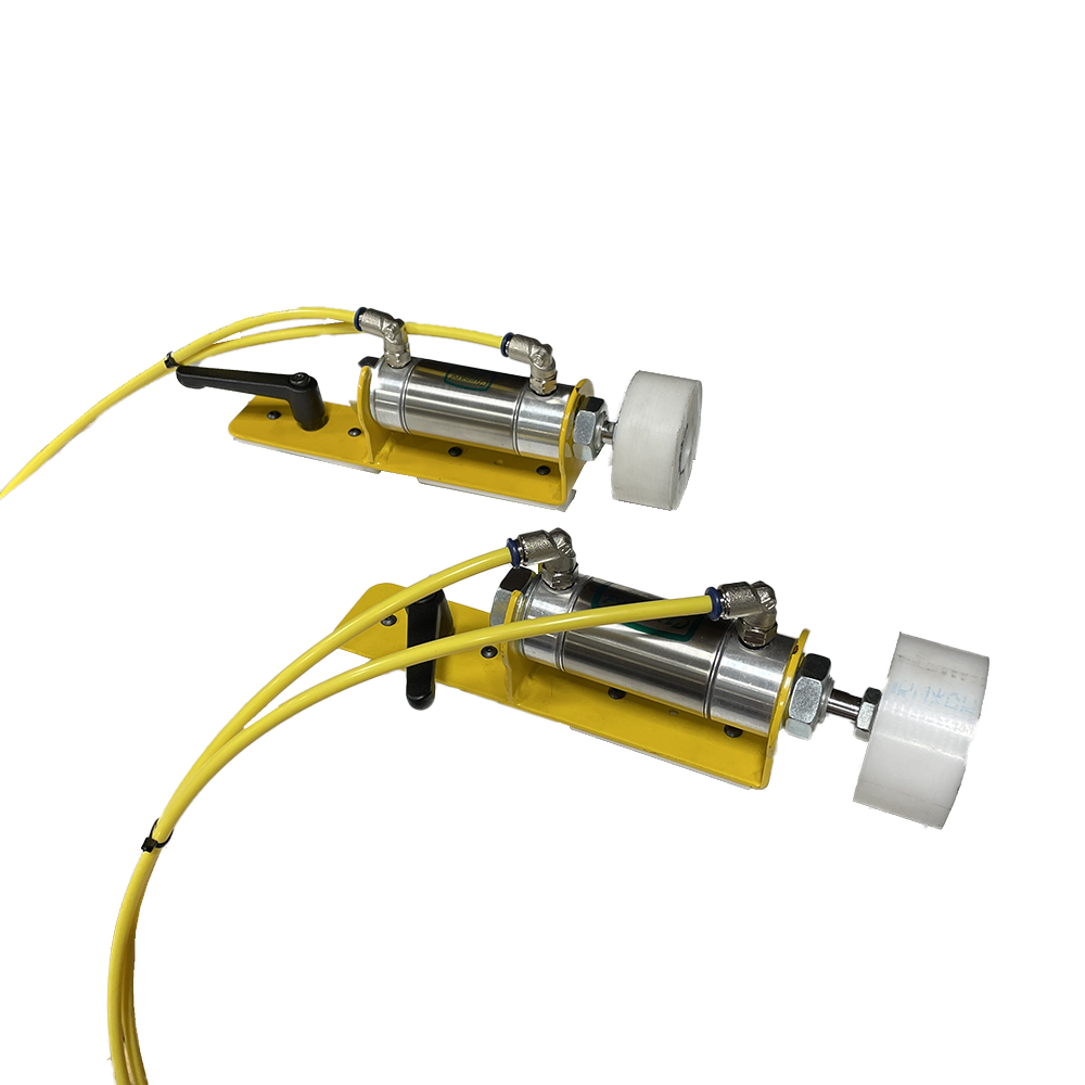 Two Pneumatic Clamps that can be added to Radial Arm Saws, Beam Saws, and Crosscut Power Saws.